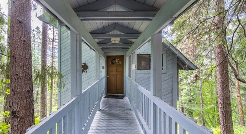 Luxury vacation rental property in a mountain or coastal destination highlighting high-end amenities and direct booking appeal