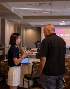 Emily Cunningham from Bluetent and an attendee speaking at the event.