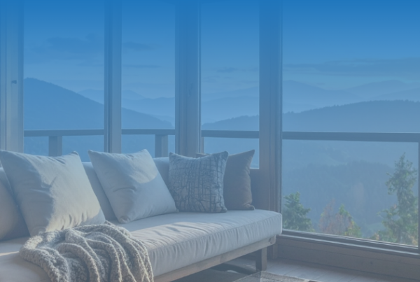 A couch with a view off mountains