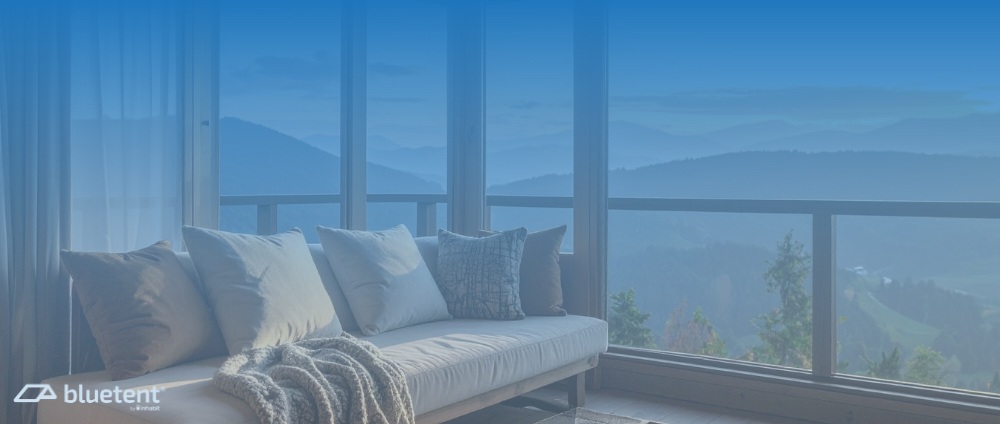A couch with a view off mountains